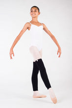 Load image into Gallery viewer, Girl wearing white leotard, ballet stockings, and black leg warmers